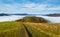 Morning foggy clouds in autumn mountain countryside. Ukraine, Carpathian Mountains, Transcarpathia. Peaceful picturesque