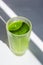 Morning green smoothie in a fluted glass, healthy lifestyle
