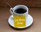 Morning greetings text on yellow notepad on coffee cup - Good morning Monday