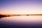 Morning in harbor. Tourists pier above sea. Sunny clear blue sky, smooth water level