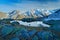 Morning in Italian Alps, mountains with small lake in the rock, hills in the clouds, Alp, Gran Paradiso, Italy.