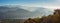 Morning landscape on hills and mountains with humidity in the air and pollution. Panorama from Linzone Mountain