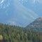 Morning landscape with mountains and at sunrise with sun reflecting. Evening with white snow and green tree and forest