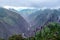 Morning landscape with Peruvian Andes mountains peaks covered with clouds at sunrise