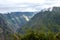 Morning landscape with Peruvian Andes mountains peaks covered with clouds at sunrise