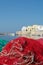 Morning landscape photo made in Gallipoli pier, colorful fishermen net after fishing, Apulia, Italy