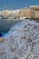 Morning landscape photo made in Gallipoli pier, colorful fishermen net after fishing, Apulia, Italy
