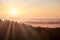 Morning landspace with sun rays. Beautiful landscape with forest and fog.Lithuanian landscape