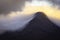 Morning light kissing mountain peak during sunrise in Scottish Highlands