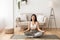 Morning Meditation. Asian Girl Practicing Yoga at Home