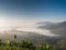 Morning mist above mountain againts sky