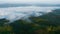 Morning mist heavy over reservoir national park, north of thailand aerial view