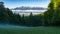 Morning mist over the clearing and clouds over the valley. Above the clouds emerges a wonderful mountain range - the Tatra