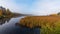 Morning mist rises off warm water into cool air on Corry lake, Ontario, Canada.