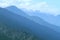 Morning mountain landscape with layer of mountain peaks covered