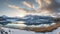 A morning panoramic shot of mountains and a lake