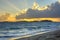 Morning rays shine over Caribbean island beach