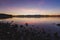 Morning Reflections: Tranquil Sunrise over a Beautiful Lake