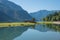 Morning scenery lake Achensee, calm water with reflection. small bridge
