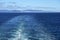 Morning at sea: Clouds and fog in a deep blue sky over Alaskan islands