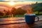 Morning serenity Coffee mug on wood, embraced by sunrise and nature