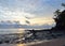 Morning Sky with Rising Sun behind Clouds at Horizon, Ocean, and Rocky Beach - Sitapur, Neil Island, Andaman Nicobar, India