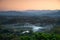 In the morning, smoke curls up from the valley and the bamboo forest is green.