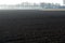 Morning spring landscape with newly plowed field, farmland in  Netherlands, Europe