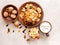 Morning still life. Healthy breakfast wheat flakes, walnuts, candied fruits, raisins, milk on a gray textured background.top