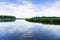 Morning sun and blue sky reflected in a centered view of a lush green salt marsh waterway near Charleston South Carolina