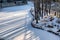 Morning sun shining through the trees snow covered the river at Gubei water town in Beijing,China