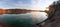 Morning sun on the shore of a sand quarry. Leningrad region. Russia.Panorama.