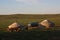 Morning sunlight and Mongol gers (tents) in the quiet steppe, Central Mongolia.