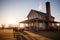 morning sunlight on a prairie house with tall chimney