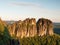 Morning sunlight on rocky towers of Schrammsteine in national park Saxony Switzerland, Germany