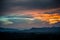 Morning sunrise over silhouetted mountains