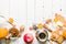 Morning tea with fruit and candied fruit. White wooden background.