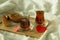 Morning turkish tea in traditional glass with bagel on the tray