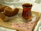 Morning turkish tea in traditional glass with bagel on the tray, breakfast in bed, valentines day