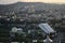 Morning view of the capital of Georgia - Tbilisi. Roofs of houses, churches and skyscrapers. Binoculars for tourists