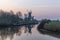 Morning view of historic twin mills in fishermens village Greetsiel, Germany