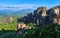 Morning view of Moni Agias Varvaras Roussanou in morning, Meteora, Greece and Varlaam monastery, rocks and valley. Rich