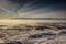 Morning wide angle view of entire Tatra range above glowing fog