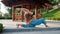 Morning yoga portrait of beautiful young woman in blue pants and top. Health care concept. Girl doing asanas on wooden