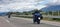 morobike motorbike travelling speeding on asphalt road in cloudy day