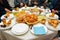 Moroccan Algerian breakfast table. Vintage background with different plates with delicious traditional middle eastern food.