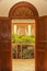 Moroccan balcony entrance with carved wooden doors and fanlight