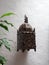 Moroccan brass lantern on whitewashed wal