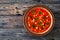 Moroccan cuisine - harira fresh vegetable soup with chickpeas and lentil on wooden table