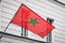 Moroccan flag on pole on building - morocco flag